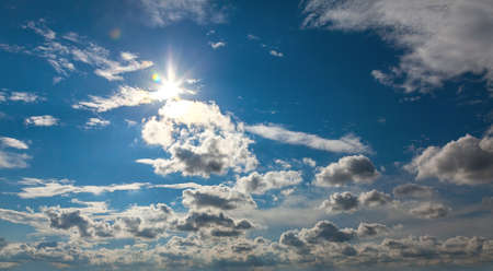 Cloudy sky with the sunの写真素材