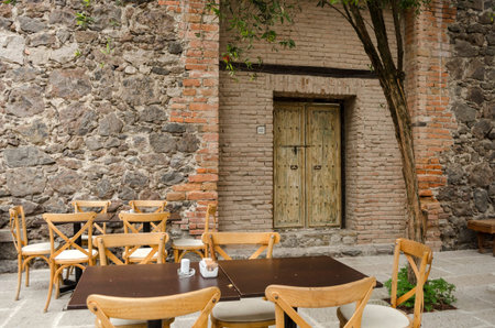 VAL'QUIRICO, TLAXCALA, MEXICO- MARCH 25, 2017: Restaurant with stone wall in a street of Val'Quirico, a new town near to Tlaxcala, Mexicoのeditorial素材