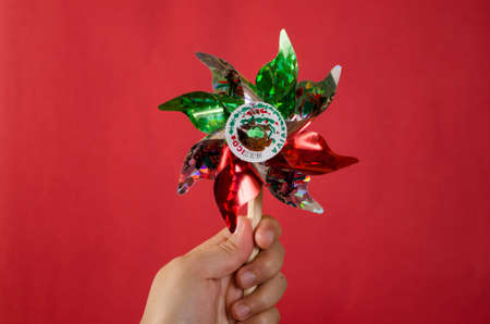Hand holding a mexican rehilete memorial to September 15の写真素材