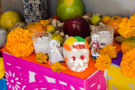 OAXACA, OAXACA, MEXICO- NOVEMBER 1, 2017: Mexican Day of the Dead offering altar with sugar skull,...