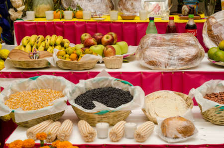 OAXACA, OAXACA, MEXICO- NOVEMBER 1, 2017: Traditional mexican Day of the Dead offering altar with fruits,bread,seeds, drinks and corn in Oaxaca, Mexicoのeditorial素材