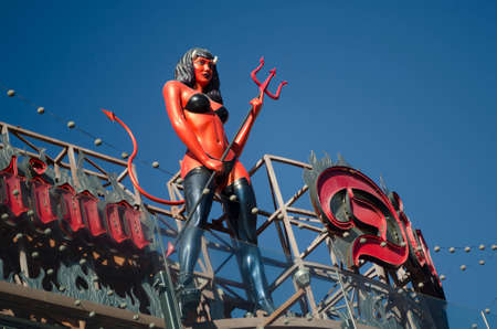 LAS VEGAS, NEVADA, USA- NOVEMBER 11, 2017: A devil girl statue stands on the top of Diablo`s Cantina in front of the Monte Carlo in Las Vegas. About 40 million people visiting the city each year.のeditorial素材