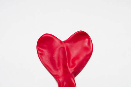 Heart shape red deflate ballon against white background. Valentine's Dayの写真素材