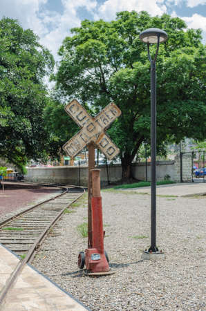 OAXACA, OAXACA, MEXICO- JUNE 1, 2018: Vintage railroad crossing, street lamp and tracks at Ferrocarril Museum in Oaxaca, Mexicoのeditorial素材
