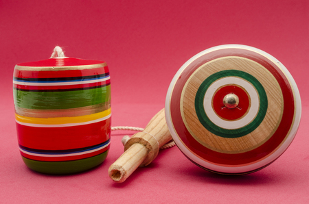 Colorful balero and me yo against red background. Mexican wooden toysの写真素材