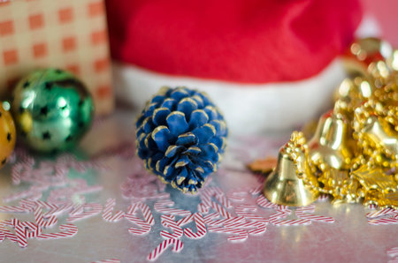 Christmas decoration with Santa Claus hat, golden little bells and christmas balls. Christmas...