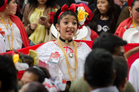 XALAPA, VERACRUZ, MEXICO- NOVEMBER 18, 2018: Young woman dressed with traditional clothes dancing at...