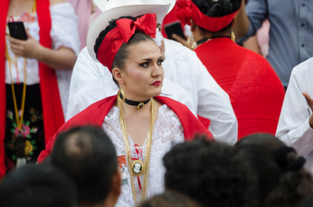 XALAPA, VERACRUZ, MEXICO- NOVEMBER 18, 2018: Woman dressed with traditional clothes dancing at...