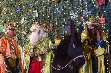 OAXACA, OAXACA, MEXICO- JANUARY 2, 2019: Wisemen Caspar Melchior and Balthasar with a dark horse and a big christmas tree at night in Oaxaca, Mexicoのeditorial素材