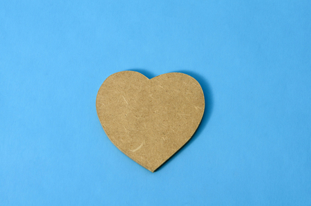 Wooden heart against blue backgroundの写真素材
