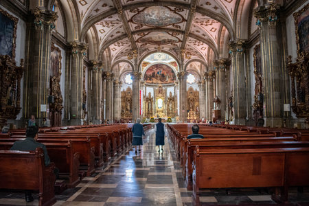 MEXICO CITY- JUNE 9, 2019: People at the interior of San Juan Bautista church in Coyoacan, Mexico...