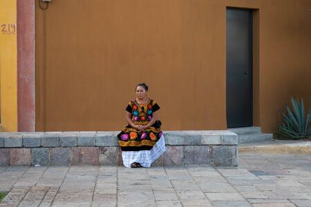 OAXACA, OAXACA, MEXICO- JULY 6, 2019: Woman dressed with traditional clothes during the Convite, a party made for invite to a big traditional party called Guelaguetza in Oaxaca, Mexicoのeditorial素材
