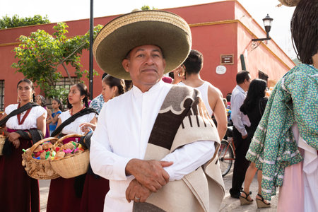 OAXACA, OAXACA, MEXICO- JULY 6, 2019: Man dressed with traditional clothes during the Convite, a party made for invite to a big traditional party called Guelaguetza in Oaxaca, Mexicoのeditorial素材