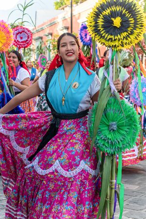 OAXACA, OAXACA, MEXICO- JULY 6, 2019: Young woman dressed with traditional clothes during the Convite, a party made for invite to a big traditional party called Guelaguetza in Oaxaca, Mexicoのeditorial素材