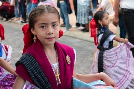 OAXACA, OAXACA, MEXICO- JULY 6, 2019: Little girl dressed with traditional clothes during the Convite, a party made for invite to a big traditional party called Guelaguetza in Oaxaca, Mexicoのeditorial素材