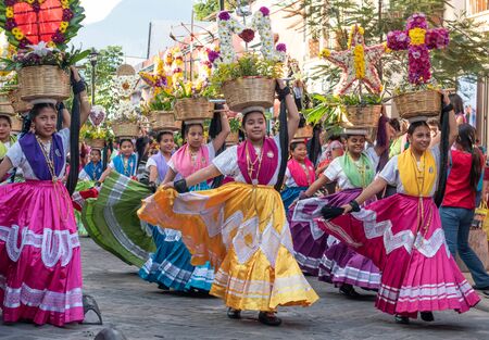 OAXACA, OAXACA, MEXICO- JULY 6, 2019: Young women dressed with traditional clothes during the Convite, a party made for invite to a big traditional party called Guelaguetza in Oaxaca, Mexicoのeditorial素材