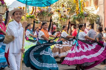 OAXACA, OAXACA, MEXICO- JULY 6, 2019: People dressed with traditional clothes during the Convite, a party made for invite to a big traditional party called Guelaguetza in Oaxaca, Mexicoのeditorial素材