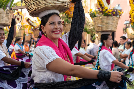 OAXACA, OAXACA, MEXICO- JULY 6, 2019: Young woman dressed with traditional clothes during the...