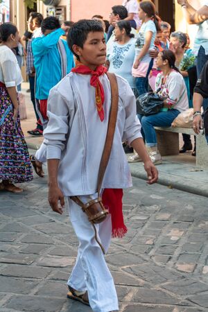 OAXACA, OAXACA, MEXICO- JULY 6, 2019: Young man dressed with traditional clothes during the Convite, a party made for invite to a big traditional party called Guelaguetza in Oaxaca, Mexicoのeditorial素材