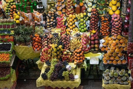 SAINT PAUL, BRAZIL- OCTOBER 24, 2019: Fruit shops at Mercado Municipal Paulistano, popular market with shops that sells fresh foods like fruits, grains, fishes, meats, etc.のeditorial素材