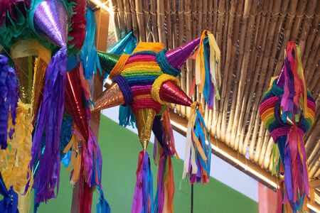 Traditional colorful mexican pinatas decoration at the market in Oaxaca de Juarez, Mexicoの写真素材