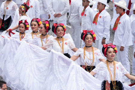 XALAPA, VERACRUZ, MEXICO- NOVEMBER 24, 2019: Young dancers dressed with traditional clothes during...