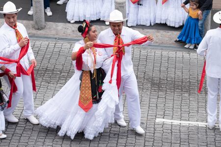 XALAPA, VERACRUZ, MEXICO- NOVEMBER 24, 2019: Young dancers dressed with traditional clothes during the Record La Bamba 2019 in Xalapa, Veracruz, Mexicoのeditorial素材