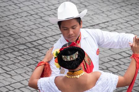 XALAPA, VERACRUZ, MEXICO- NOVEMBER 24, 2019: Young couple dancing and dressed with traditional clothes during the Record La Bamba 2019 in Xalapa, Veracruz, Mexicoのeditorial素材