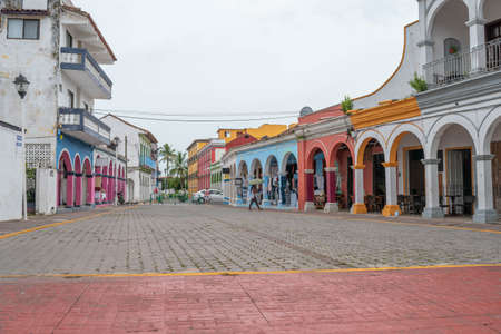 TLACOTALPAN, VERACRUZ, MEXICO- AUGUST 20, 2021: Typical street view at Tlacotalpan downtown with colorful houses in a cloudy dayのeditorial素材