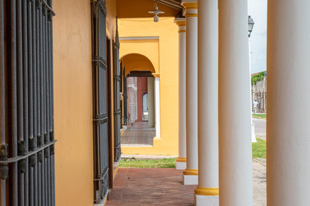 TLACOTALPAN, VERACRUZ, MEXICO- AUGUST 21, 2021: Corridor at the exterior of a typical yellow house...