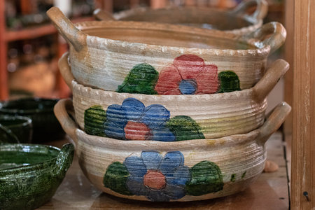 Traditional clay pots with painted flowers at a store in Oaxaca, Mexico