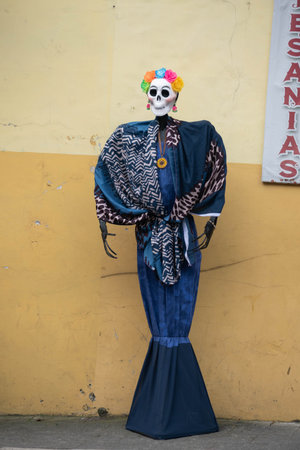 XICO, VERACRUZ, MEXICO- OCTOBER 26, 2021: Skeleton dressed with an elegant blue dress at the street in magical town of Xico, Veracruz, Mexico. Decoration for Mexican Day of the deaのeditorial素材