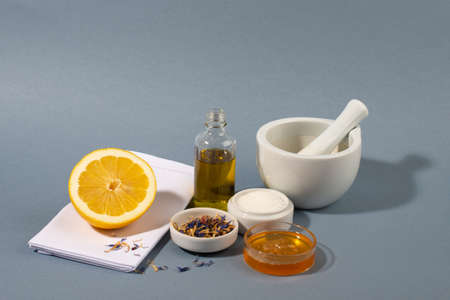 Sugar scrub body mask ingredients on blue background.  Eco friendly cosmetics. DIY homemade natural skin care products.の写真素材