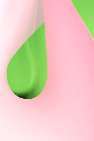 Colour paper geometric shape. Green and pink paper with shadow effect and selective focus. Abstract background. Copy space.の写真素材