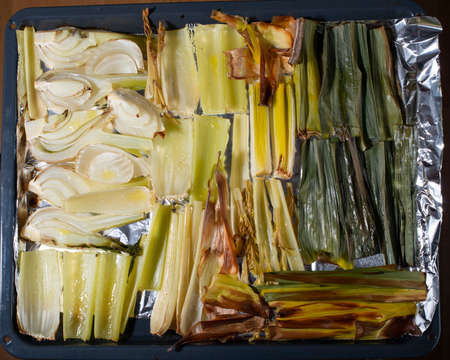 Roasted fennel and celery on sheet pan. Top view. Concept of healthy eating.の写真素材