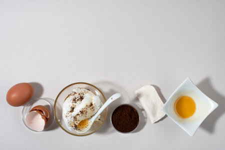 Egg WhiteÂ Face Mask ingredients. Whipped egg white, honey, coffee grounds. Top view. Banner.
