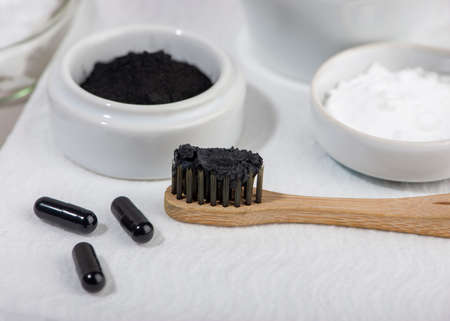 Homemade charcoal powder Toothpaste. Home beauty concept. Close up. Selective focus.の写真素材