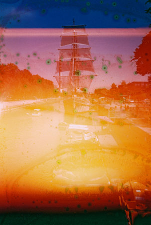 Vintage distressed blurry and grained photo. Damaged camera film. Mystical, psychedelic, nostalgic picture. View from ship.の写真素材