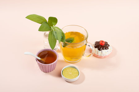 Cup of sage herbal tea, fresh sage leaves, honey and lemon. Home remedies.