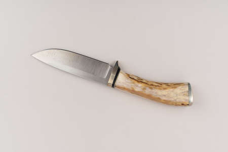 Hunting knife isolated on grey background, top view.の写真素材