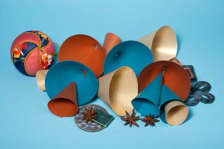 Organic modern shiny Christmas decorations on blue background.