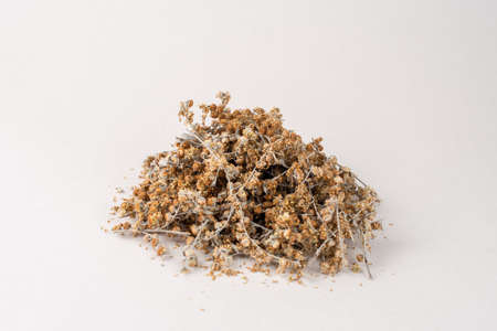Heap of dried wormwood herb isolated on white background.の写真素材