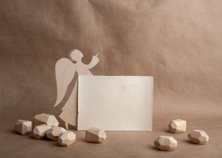 Hand made wooden angel and blank card with space for your text. Minimal eco Christmas concept. Scandinavian style.の写真素材