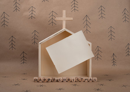 Hand made wooden Church and blank card with space for invitation or greeting. Minimal eco Christmas concept.の写真素材