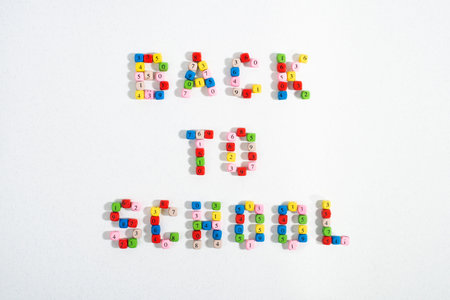 Text Back To School made of colourful number beads on white background. Back to school concept.