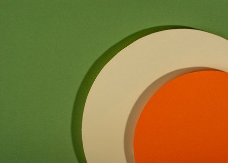 Minimalist green, orange and white paper composition with shadows. Abstract geometric paper backgroundの写真素材