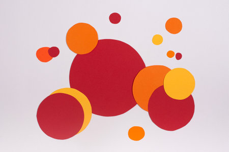A colourful flat circles composition. Geometric red and orange paper collageの写真素材