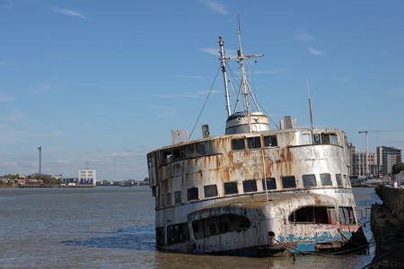 The derelict boat the HMS Iris moored on the River Thamesのeditorial素材