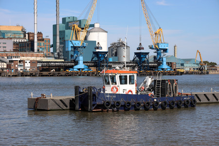 A tug boat moored on the River Thamesのeditorial素材