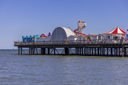 Fun for all on the colourful seaside pierのeditorial素材